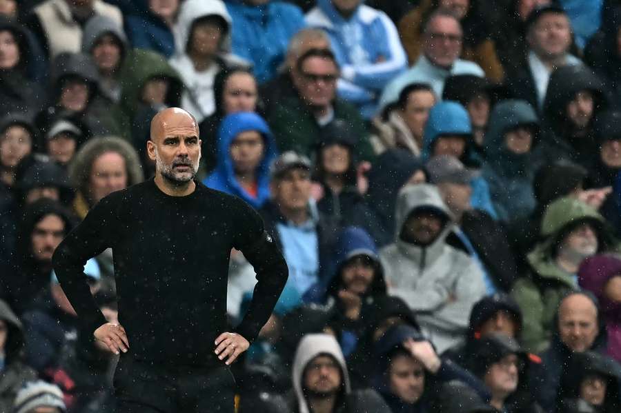 Manchester City manager Pep Guardiola looks on against Arsenal