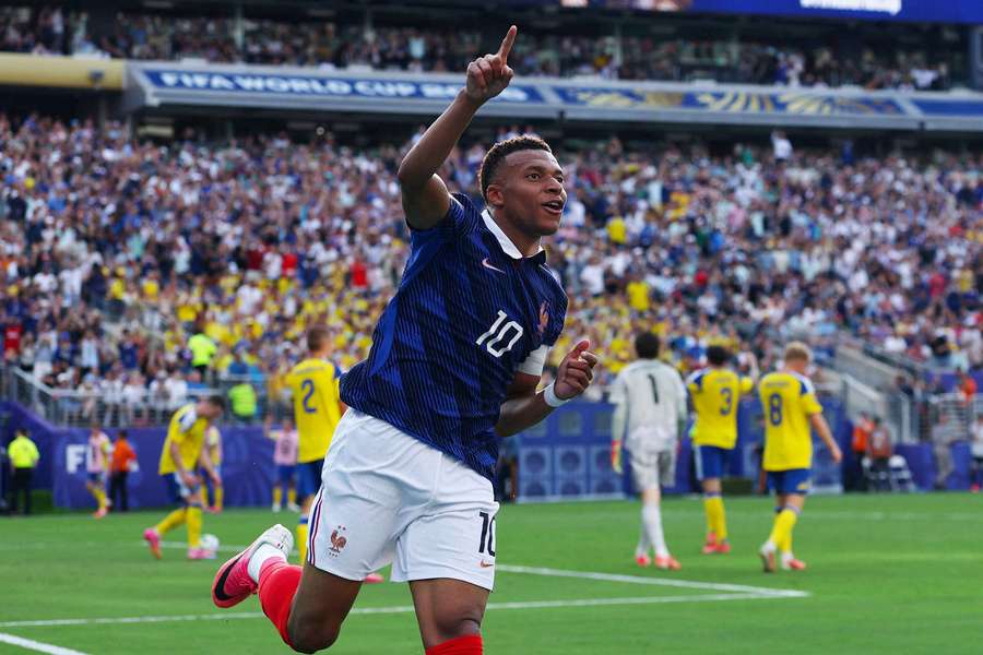 Kylian Mbappé celebrates scoring France's third goal against Sweden to draw level with Lionel Messi in the race for the Golden Boot Kylian Mbappé celebrates scoring France's third goal against Sweden to draw level with Lionel Messi in the race for the Golden Boot