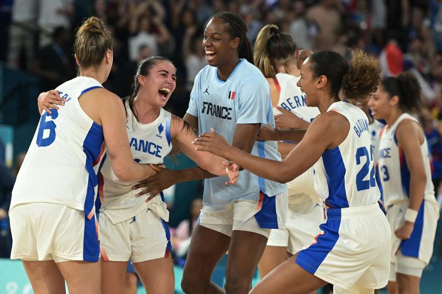 France's Marine Fauthoux (second left) and teammates celebrate after beating Belgium in overtime