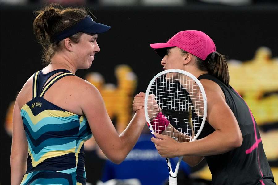 Linda Noskova (left) is congratulated by world number one Iga Swiatek after progressing in Melbourne