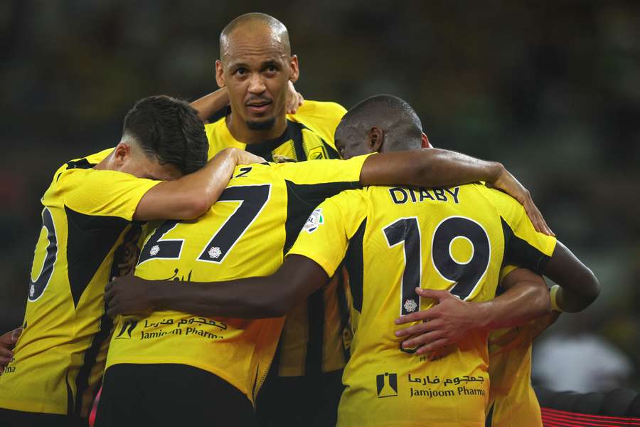 Houssem Aouar of Al Ittihad celebrates with teammates after scoring the third goal during the Saudi Pro League match between Al Ittihad and Al Ettifaq