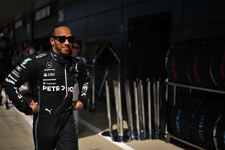 Lewis Hamilton walks to his garage during the second practice session ahead of the British Grand Prix