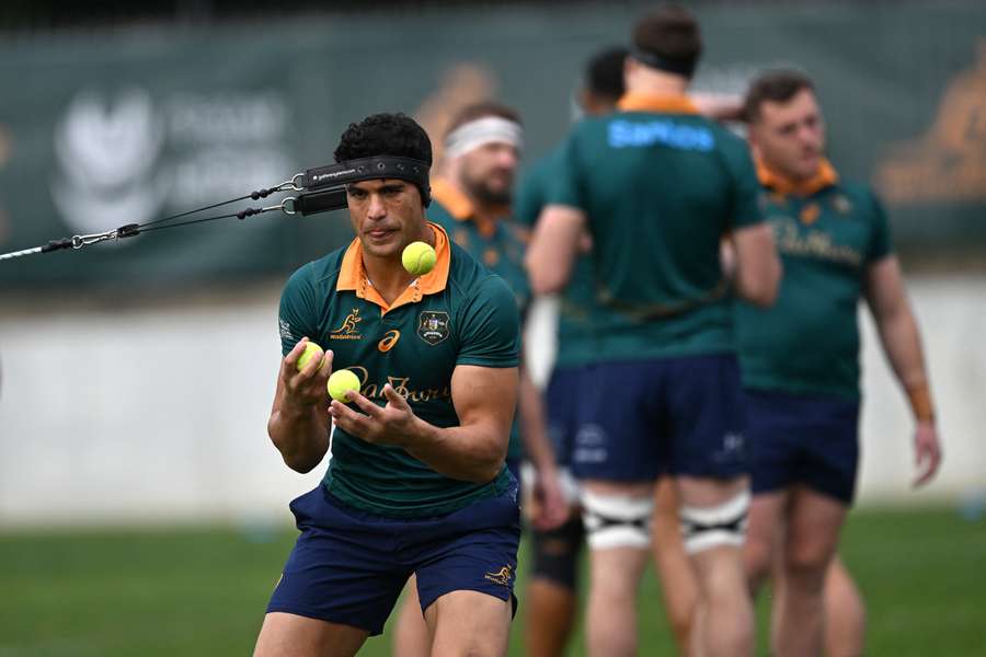 Joseph-Aukuso Suaalii goes through some stretching exercises at Wallabies training on Thursday.
