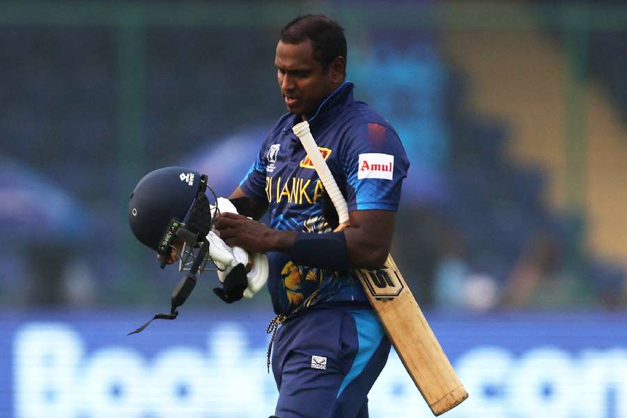 Angelo Mathews walks after losing his wicket due to a time-out