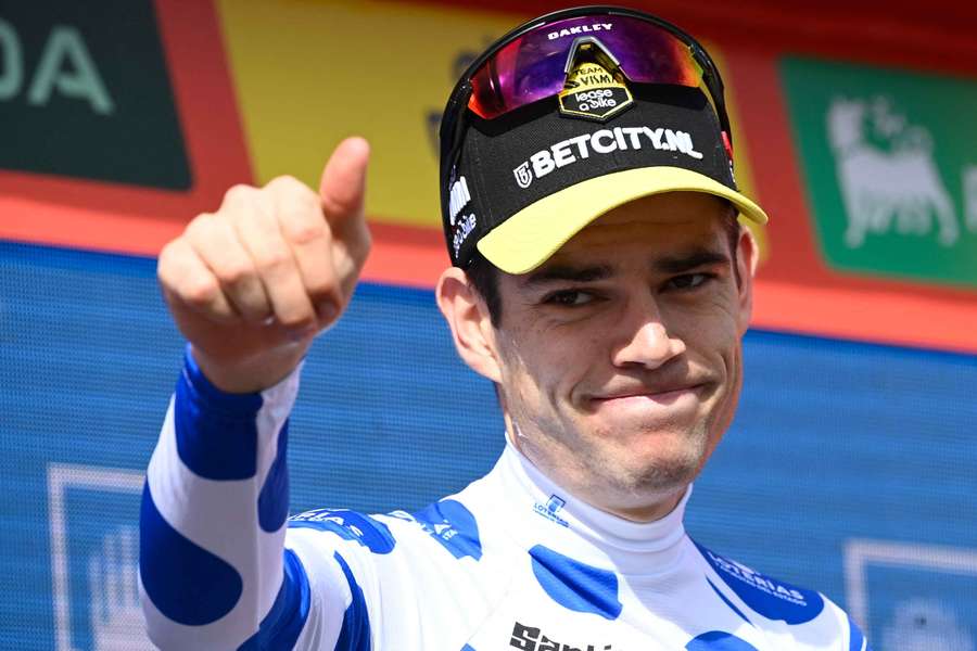 Wout van Aert celebrates on the podium after winning stage 14 of the Vuelta a Espana