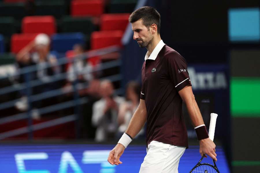 Novak Djokovic looks dejected after losing his match against Poland's Hubert Hurkacz in Shanghai