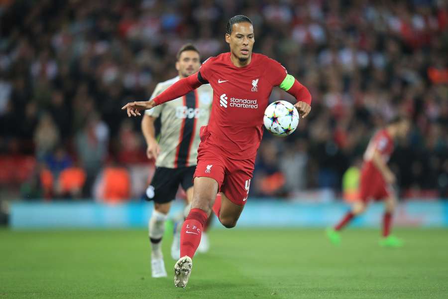 Liverpool's Dutch defender Virgil van Dijk runs with the ball against Ajax.