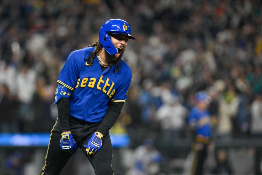 Seattle Mariners shortstop J.P. Crawford celebrates after hitting a grand slam against the Texas Rangers