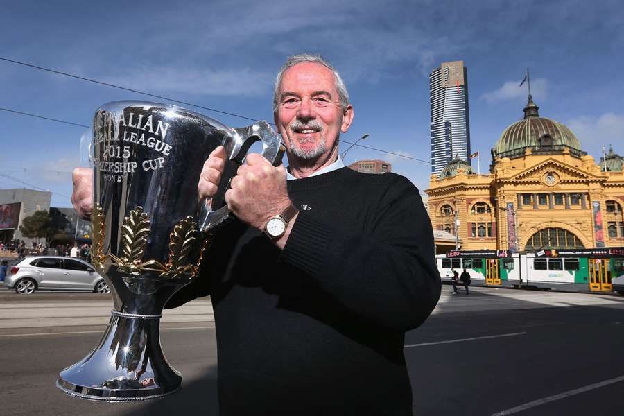 Robert Walls poses with the 2015 AFL Premiership Cup in front of Flinders Street Station in Melbourne.
