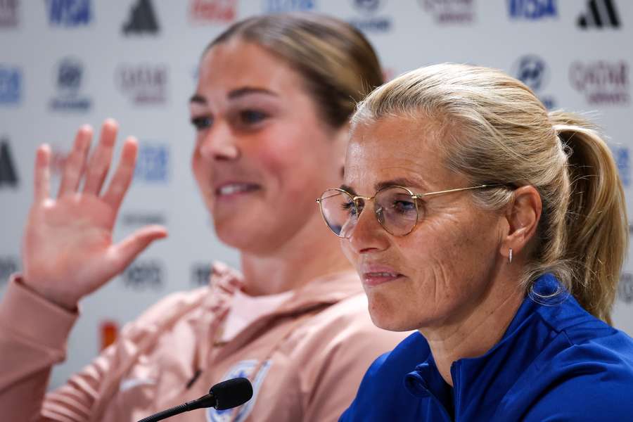 Wiegman (R) speaks to the media