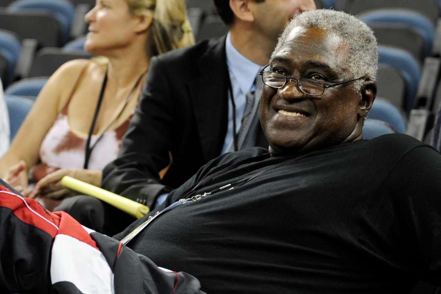 Former NBA star Willis Reed smiles during a US basketball team training session