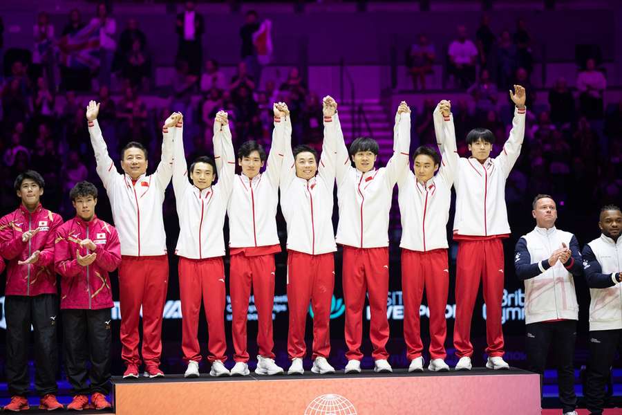 Team China (including Wei Sun, Boheng Zhang, Jiaxing Yang, Hao You, and Jingyuan Zou) celebrate