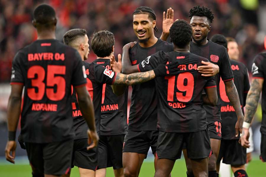 Leverkusen's players celebrate their opening goal Leverkusen's players celebrate their opening goal