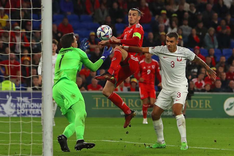 Poland's goalkeeper Wojciech Szczesny saves from Wales' midfielder Gareth Bale during their Nations League match in Cardiff.