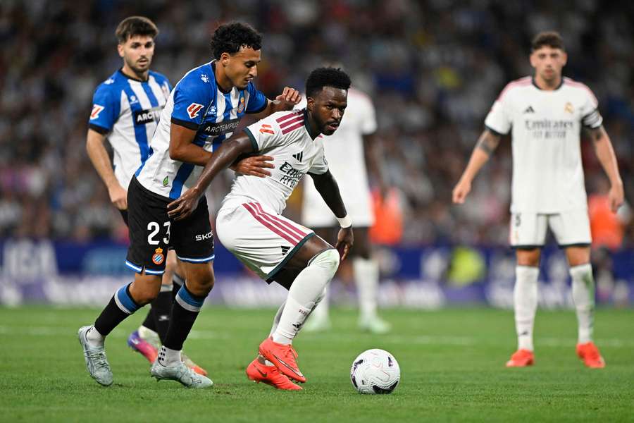 Real Madrid's Vinicius Junior in action with Espanyol's Omar El Hilali. Real Madrid's Vinicius Junior in action with Espanyol's Omar El Hilali.