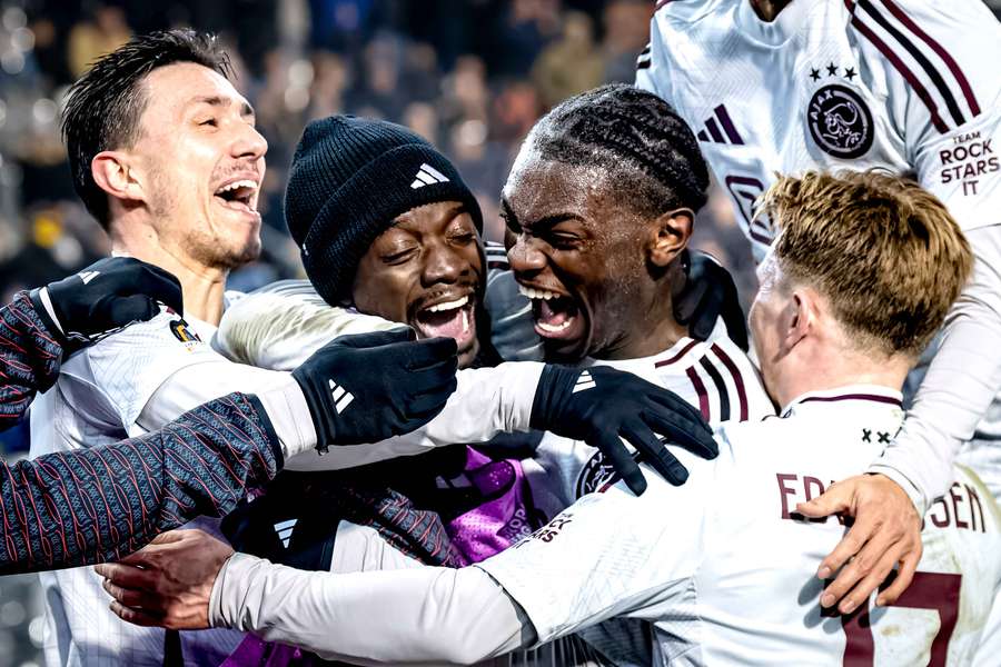 Ajax celebrate Jorthy Mokio's (third from the left) goal during the first leg against Royale Union Saint-Gilloise