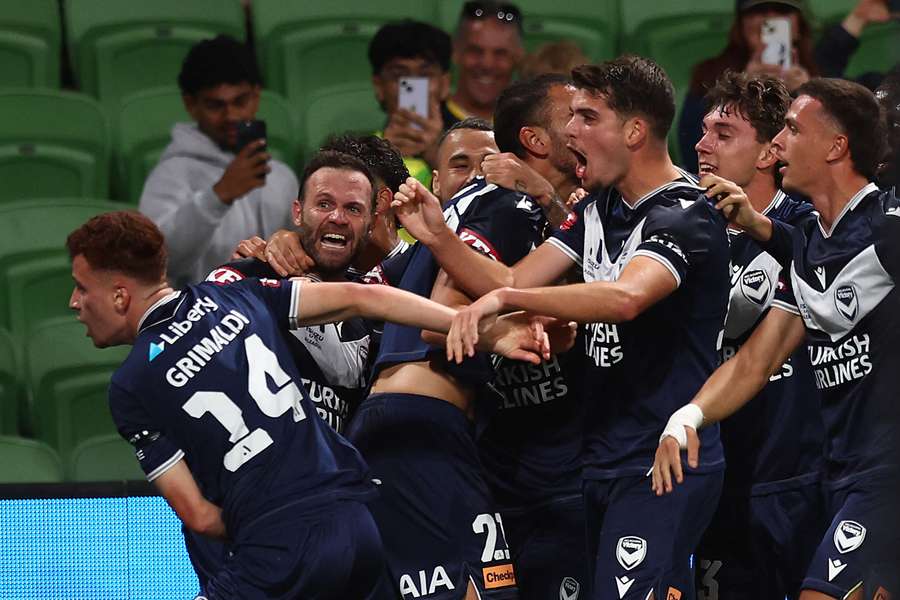 Melbourne Victory players celebrate Matt Grimaldi's last gasp winner in the last Melbourne Derby. Melbourne Victory players celebrate Matt Grimaldi's last gasp winner in the last Melbourne Derby.