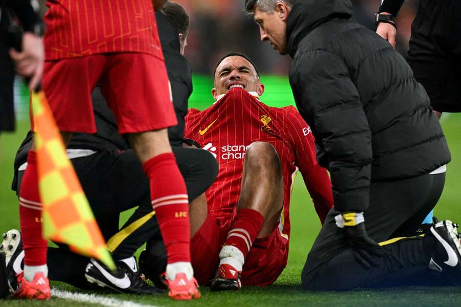 Liverpool's Trent Alexander-Arnold reacts following an injury during the last 16 second leg UEFA Champions League match against Paris Saint-Germain