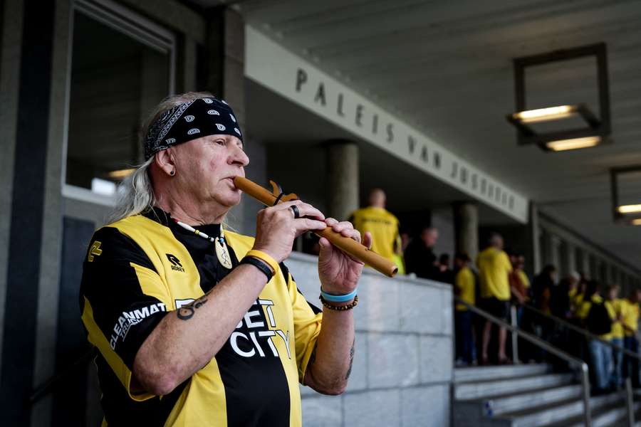 A Vitesse fan plays the flute as fans make music outside the courtroom in Arnhem during Monday's appeals case A Vitesse fan plays the flute as fans make music outside the courtroom in Arnhem during Monday's appeals case