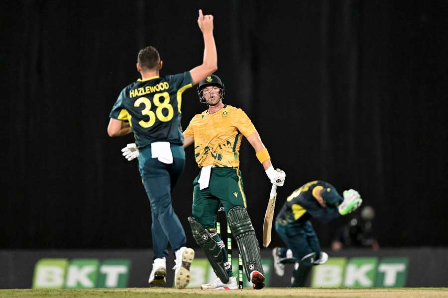 Josh Hazlewood (L) celebrates after the dismissal of South Africa’s Tristan Stubbs