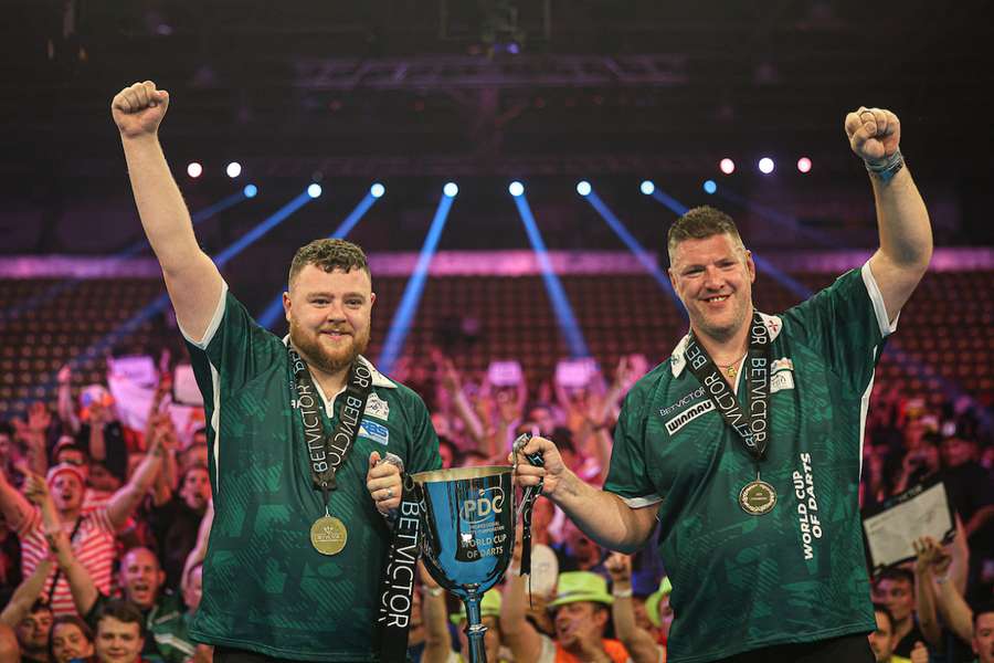 Josh Rock and Daryl Gurney celebrate Northern Ireland's victory at the World Cup of Darts