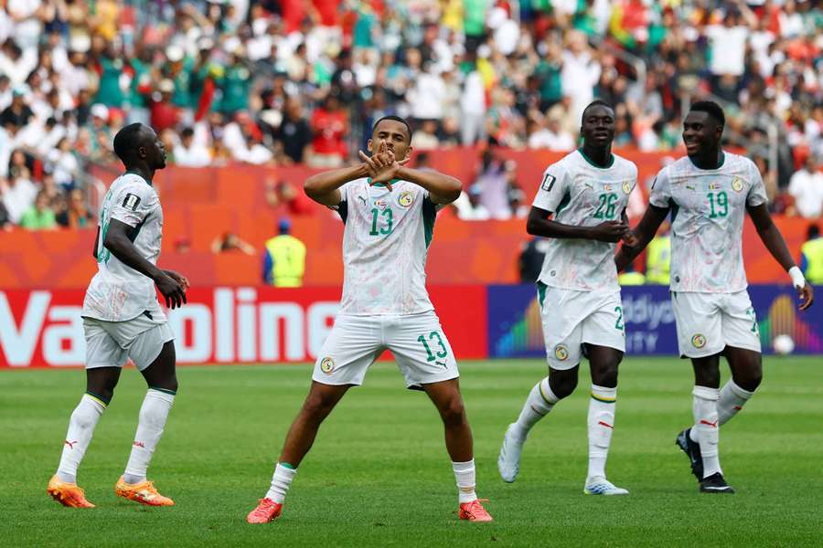 Senegal celebrate one of their goals during their victory over Iraq.