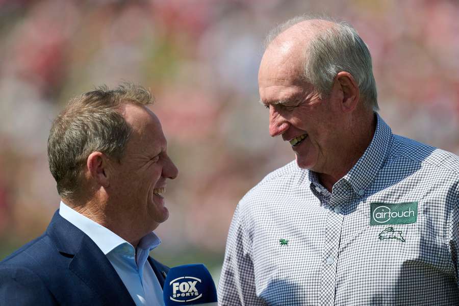 Kevin Walters speaking with Souths coach Wayne Bennett during his time as a TV pundit.
