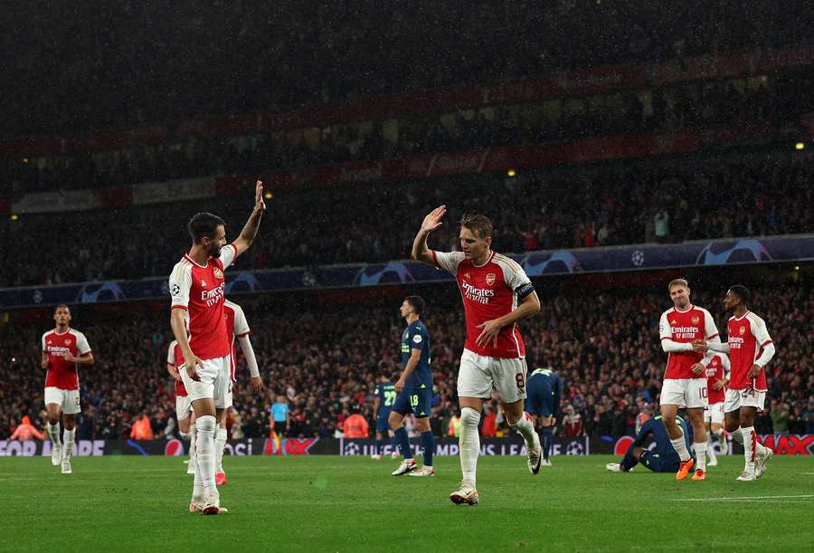 Martin Odegaard celebrates scoring against PSV to make it 4-0 to Arsenal