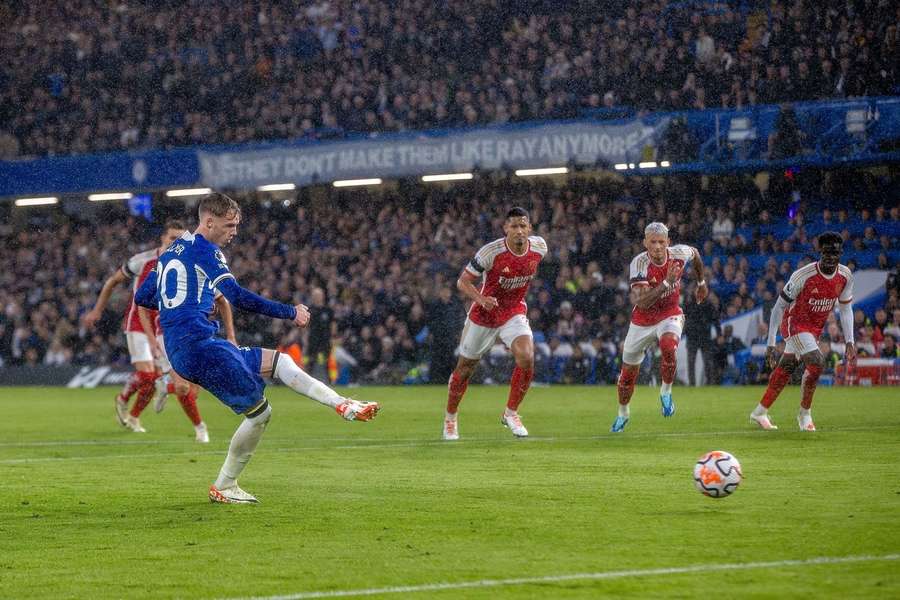 Chelsea midfielder Cole Palmer scores a penalty during the Premier League match against Arsenal