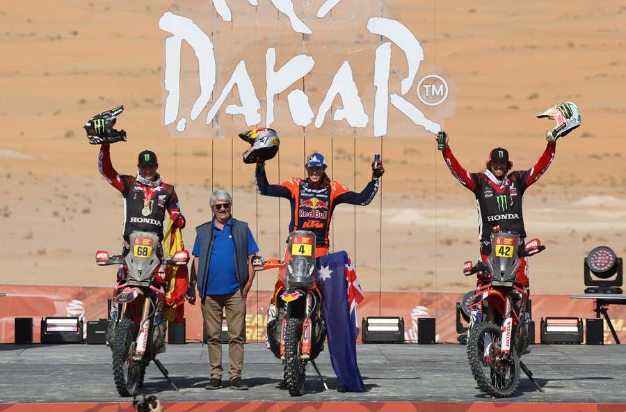 Red Bull KTM Factory Racing's Daniel Sanders, centre, celebrates after winning in the bike category Red Bull KTM Factory Racing's Daniel Sanders, centre, celebrates after winning in the bike category