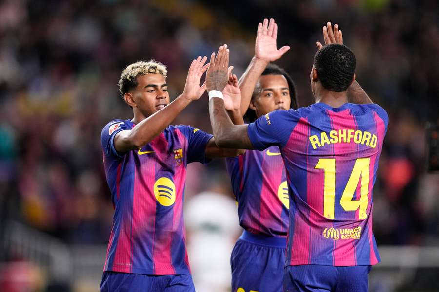 Barcelona celebrate scoring a goal against Elche