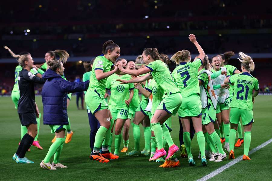 Wolfsburg players celebrate after the match