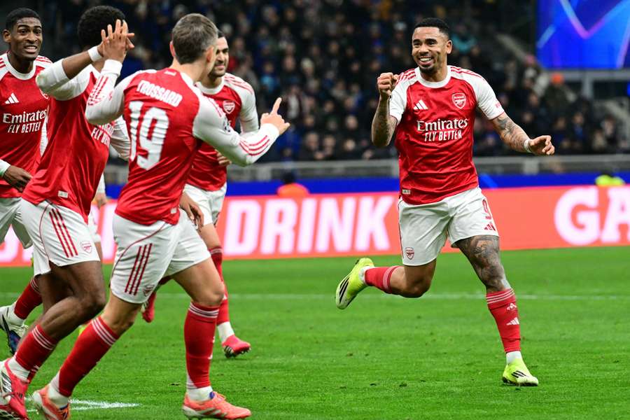 Arsenal celebrate after Jesus doubled the visitors' lead in Milan
