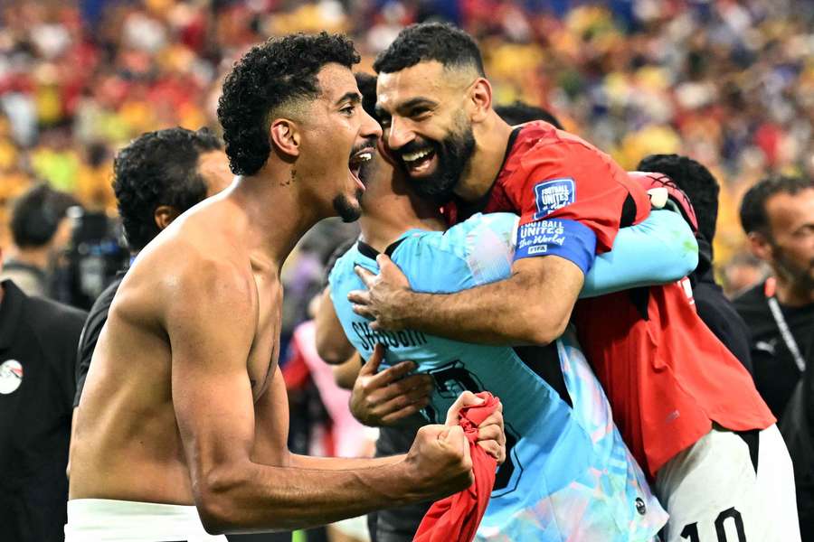 Mohamed Salah, Hossam Abdelmaguid and Mostafa Shoubir celebrate after the match as Egypt qualify for the last 16 of the World Cup Mohamed Salah, Hossam Abdelmaguid and Mostafa Shoubir celebrate after the match as Egypt qualify for the last 16 of the World Cup