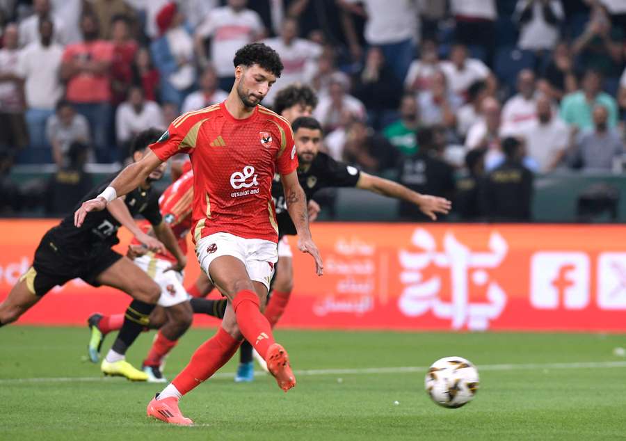 Al Ahly's Wessam Abou Ali scores their first goal from the penalty spot