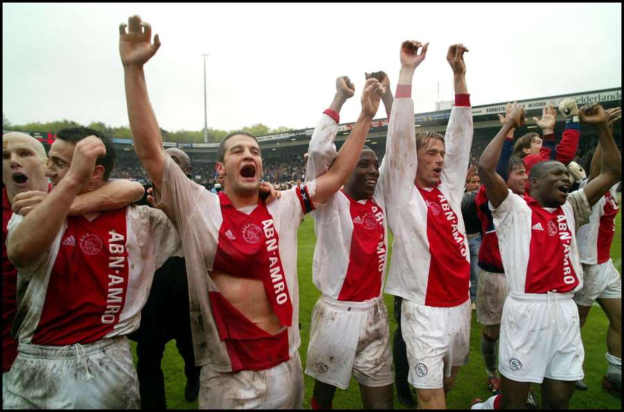 Cristi Chivu (second from left) celebrates winning the title with Ajax Cristi Chivu (second from left) celebrates winning the title with Ajax