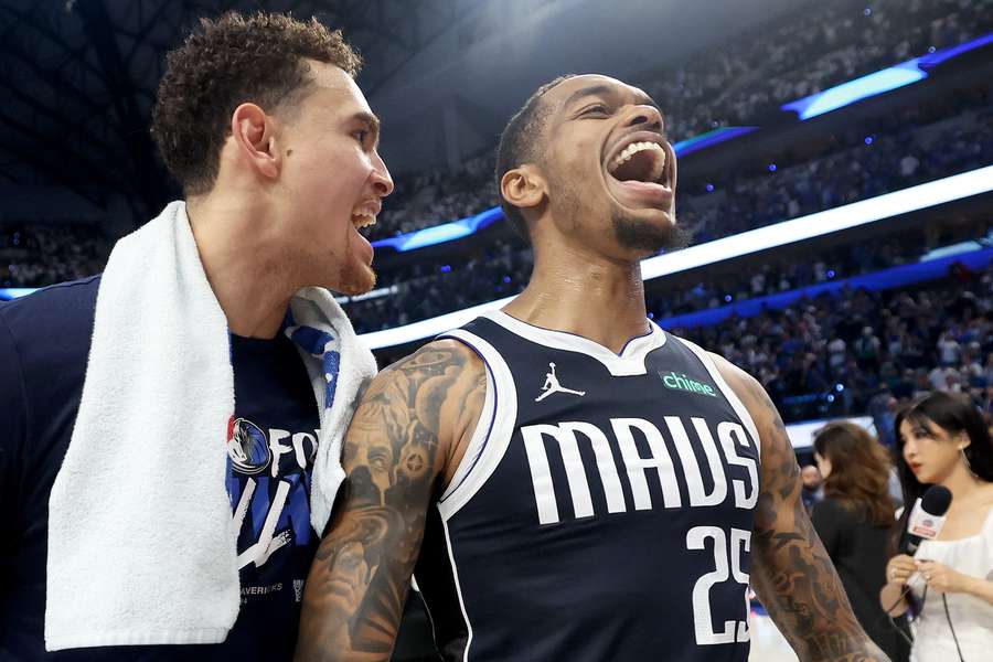 Dallas Mavericks' P.J. Washington (right) celebrates after a win Dallas Mavericks' P.J. Washington (right) celebrates after a win