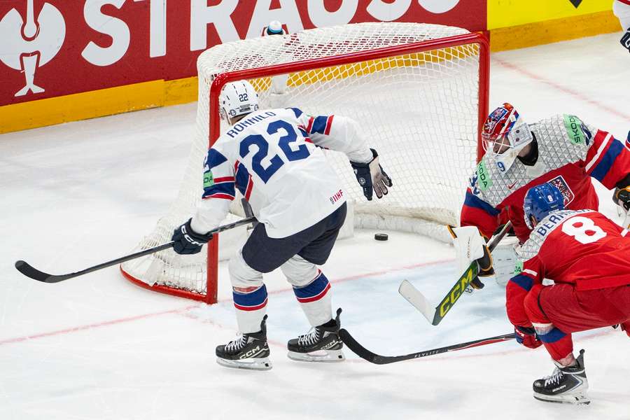 Norway's Martin Ronnild, left, scores to 3-1 against Czechia's goaltender Dominik Pavlat Norway's Martin Ronnild, left, scores to 3-1 against Czechia's goaltender Dominik Pavlat