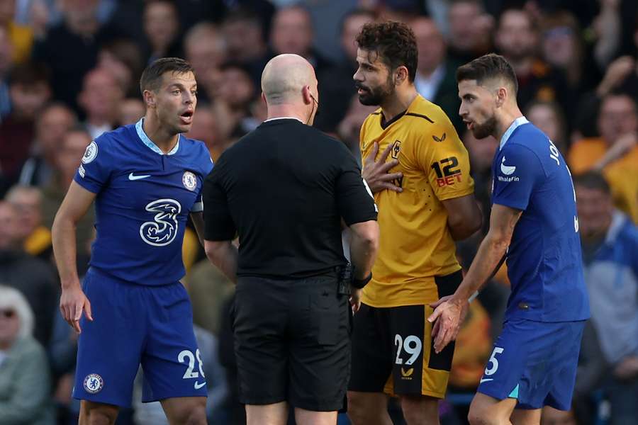 Former Chelsea star Diego Costa speaks with referee Simon Hooper after winning a free kick during the match between Chelsea and Wolves