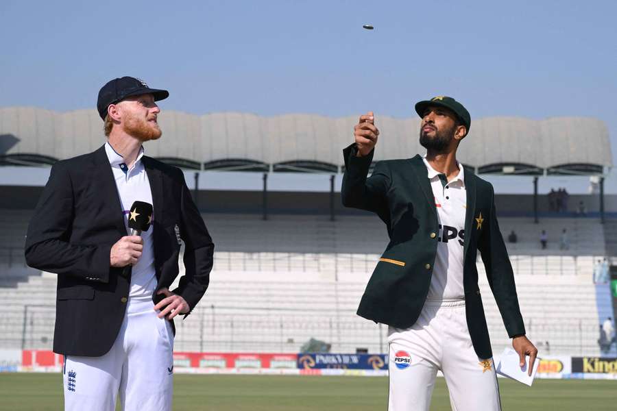 Pakistan captain Shan Masood (R) tosses the coin on day on of the second Test