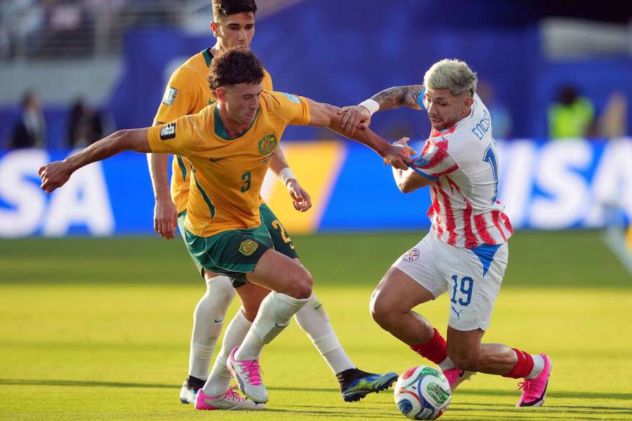 Alessandro Circati tussles with Paraguay's Julio Enciso at the FIFA World Cup. Alessandro Circati tussles with Paraguay's Julio Enciso at the FIFA World Cup.