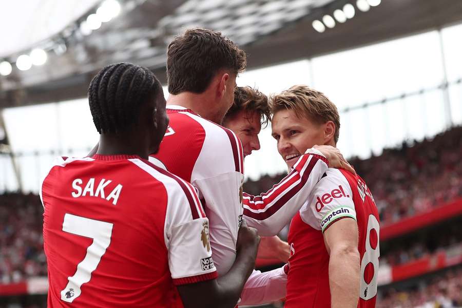 Arsenal celebrate scoring the winning goal Arsenal celebrate scoring the winning goal