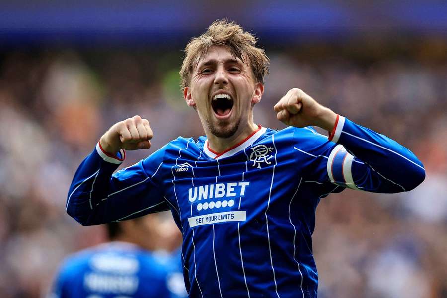 Neil celebrates after scoring Rangers' first goal against Celtic