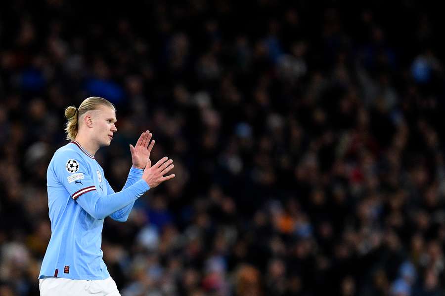 Manchester City's Norwegian striker Erling Haaland applauds the fans as he leaves the pitch after being substituted