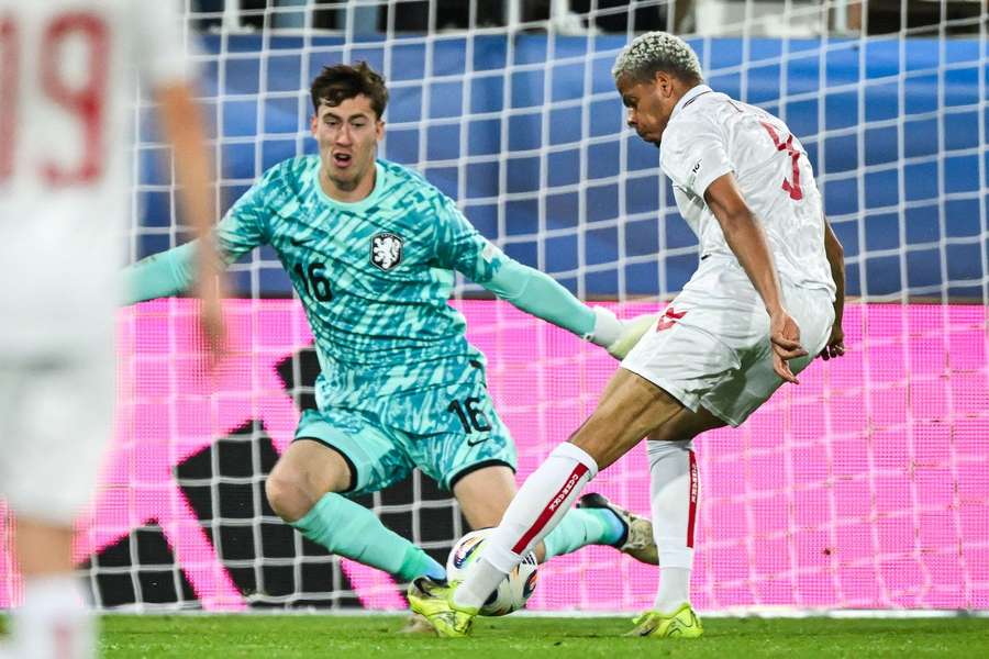Holland U21 goalkeeper Robin Roefs trying to save a shot from Denmark's Williams Osula