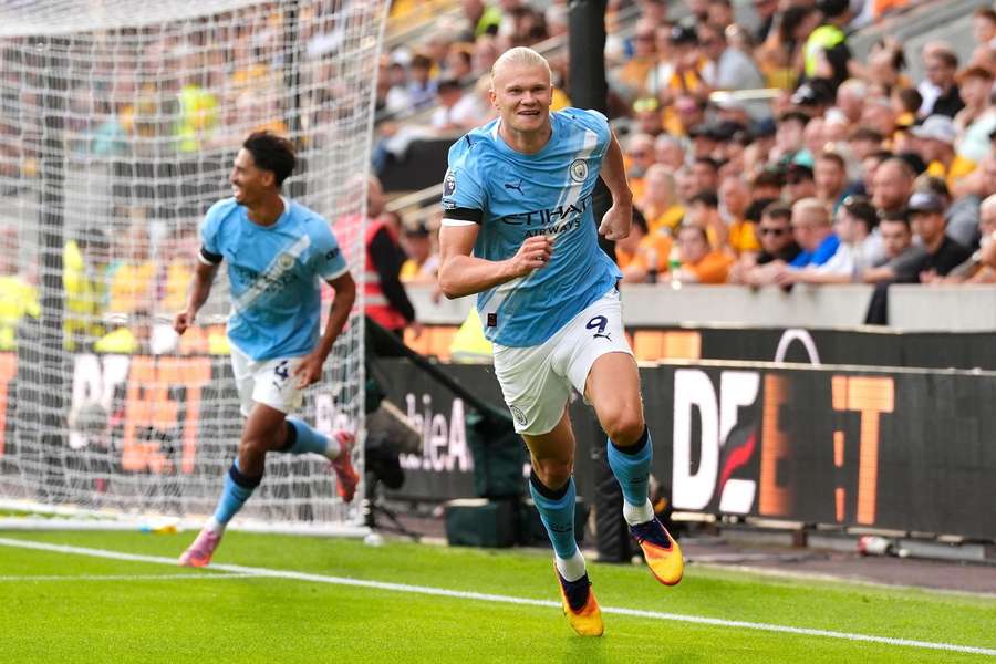 Manchester City's Erling Haaland (right) celebrates scoring his side's third goal 