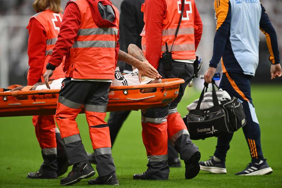 Eder Militas had to be helped off the pitch with a stretcher