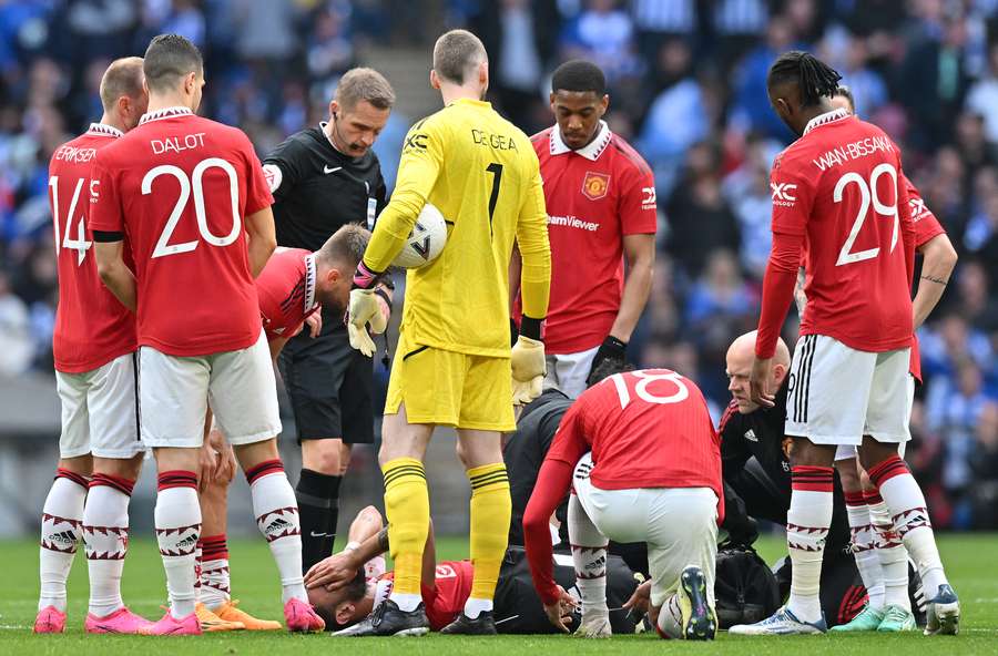 Manchester United's Portuguese midfielder Bruno Fernandes receives medical treatment Manchester United's Portuguese midfielder Bruno Fernandes receives medical treatment