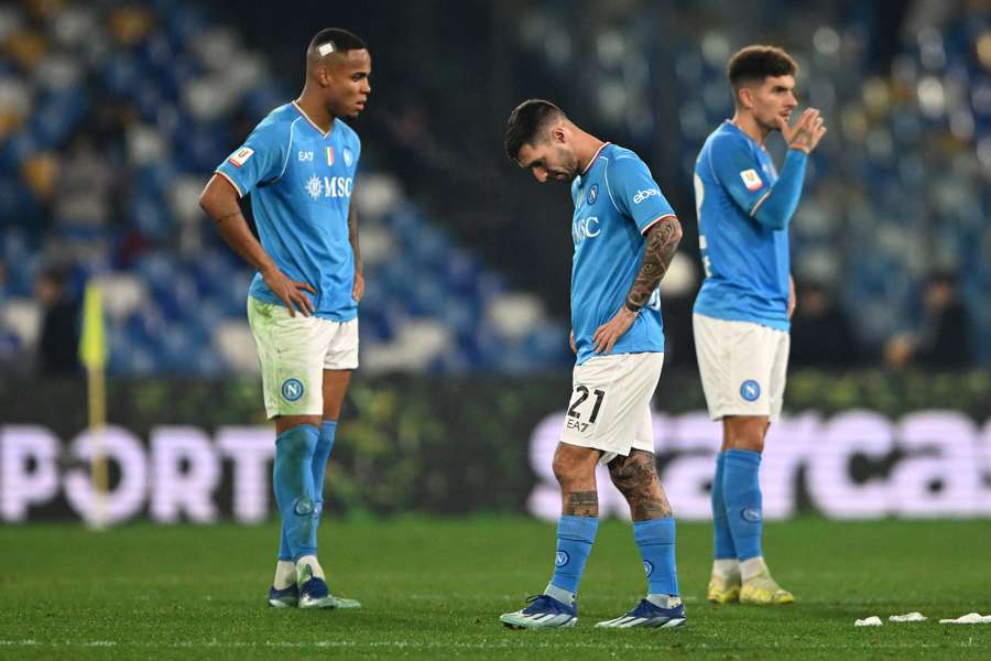 Napoli players look dejected after the shock loss