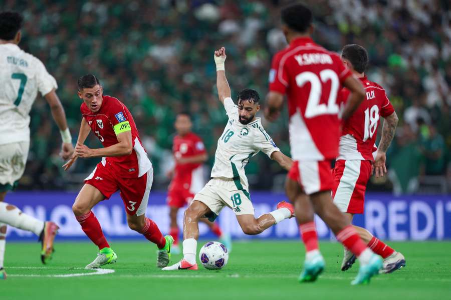 Saudi Arabia's Saleh Abu Al Shamat scores the first goal in the FIFA World Cup qualifiers against Indonesia